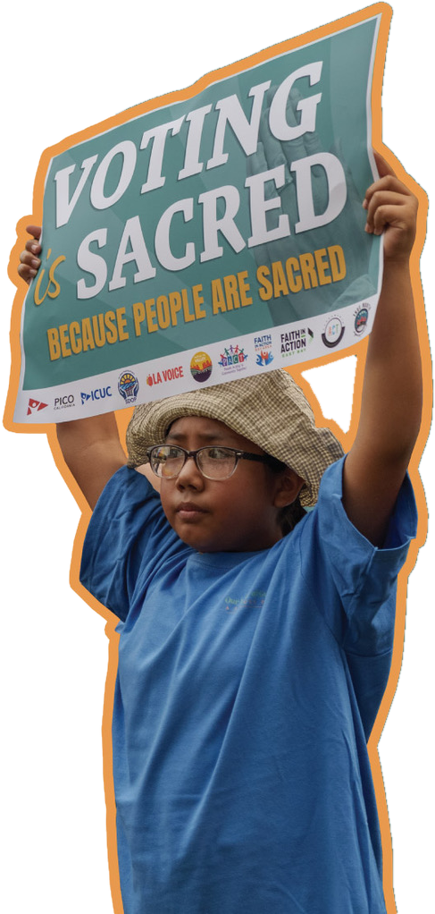 A young person holding a Voting Is Sacred sign